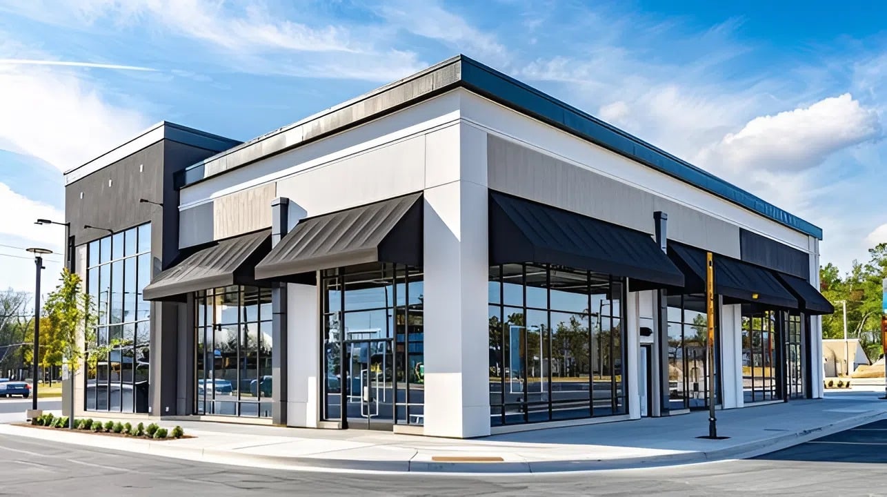 Modern building with crisp white and charcoal exterior paint by an exterior painter in Hillsborough, CA.