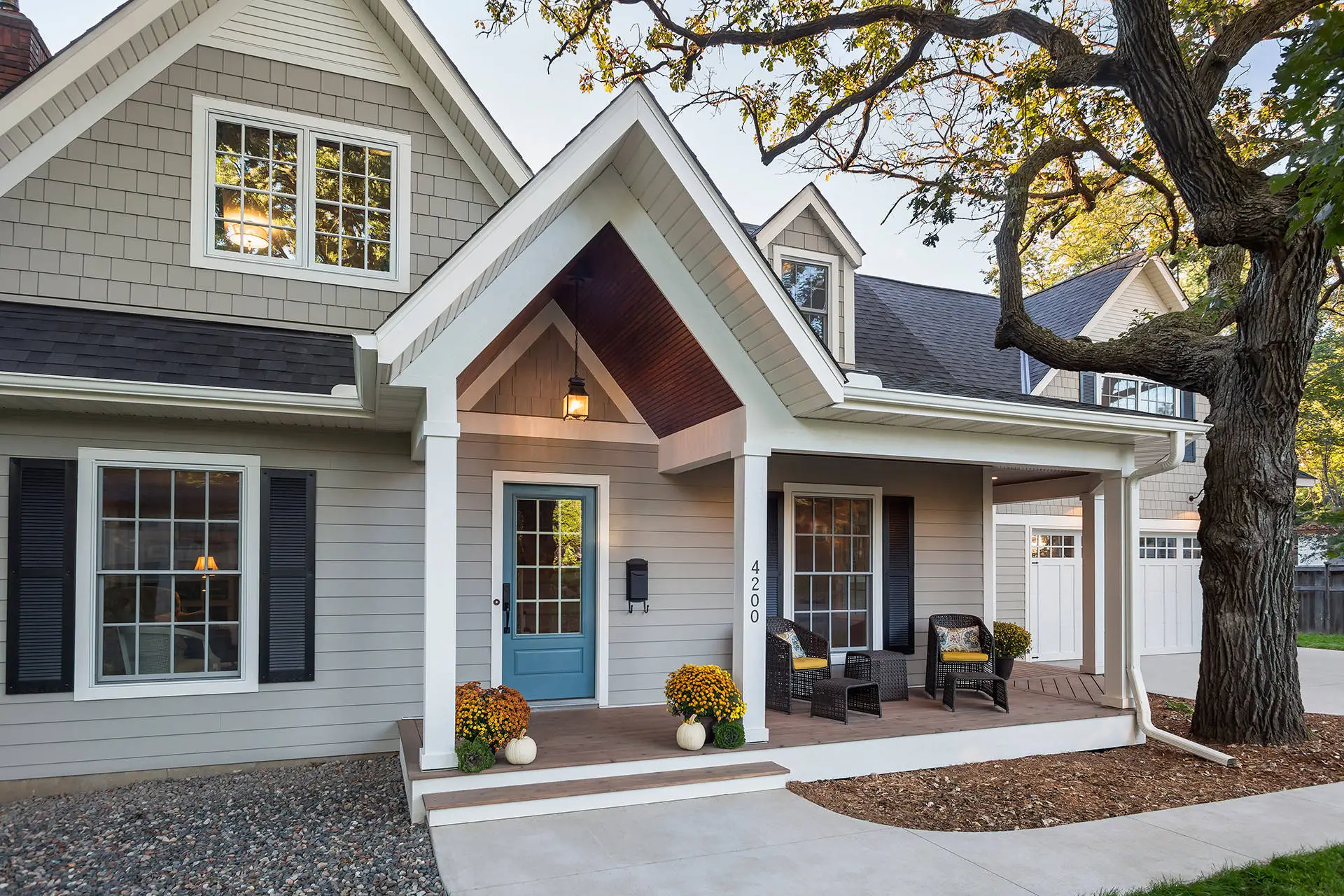 Light gray painted siding with crisp white trim by an exterior painter in Atherton, CA