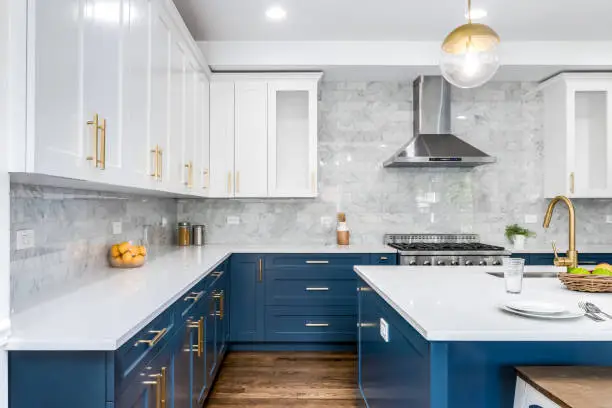 Modern two-tone navy blue cabinets and crisp white trims by an interior painter in Menlo Park, CA