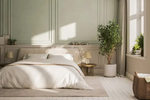 Soft sage green bedroom walls with a matte paint finish and crisp white trim by a house painter in Burlingame, CA.
