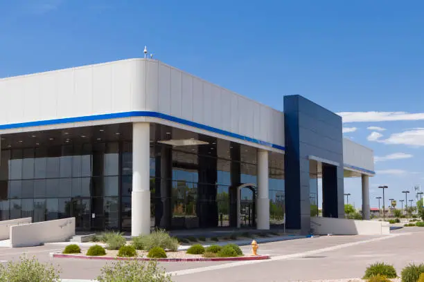Building exterior featuring crisp white and deep blue accent colors by a painting company in Hillsborough, CA