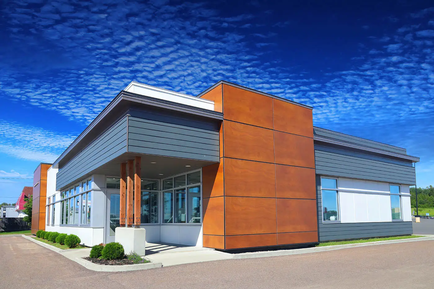 Commercial building with modern exterior siding and clean painted finishes by an exterior painter in San Mateo, CA