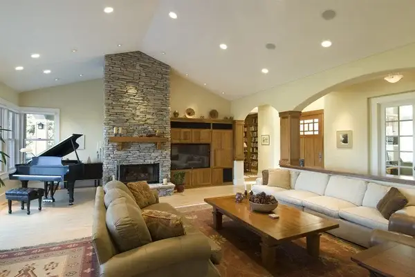 Warm neutral living room with cream walls and contrasting door trims by a house painter in Palo Alto, CA.