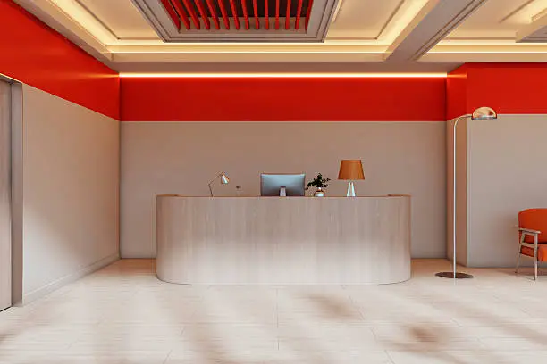 Office reception with a bold red accent wall and coordinating trim colors by a painting company in Atherton, CA.